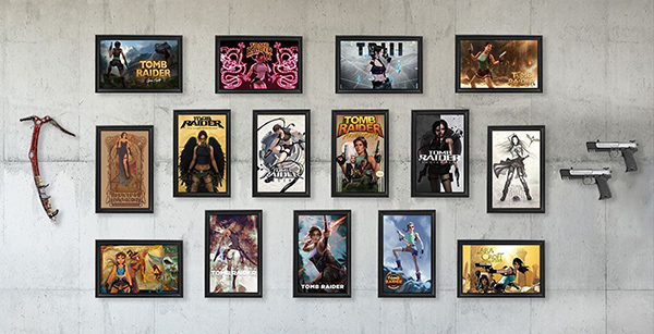 Fifteen TR25 Reimagined Box Art posters arranged on a wall with Tomb Raider memorabilia